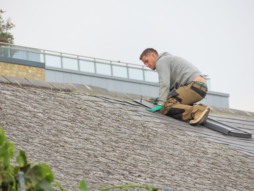 Professional skylight installation demonstrating code-compliant flashing and weatherproofing